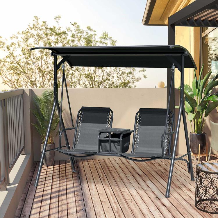 Black 2-person porch swing with canopy and two sling seats on a wooden deck