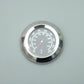 Grill lid thermometer dial with temperature markings in Celsius