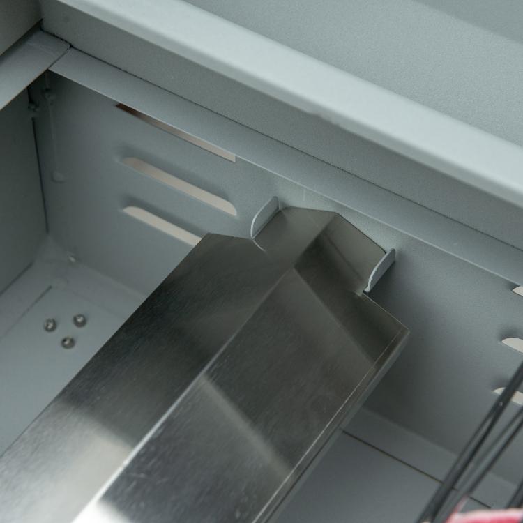 Pull-out grease tray inside the 2-burner gas grill base