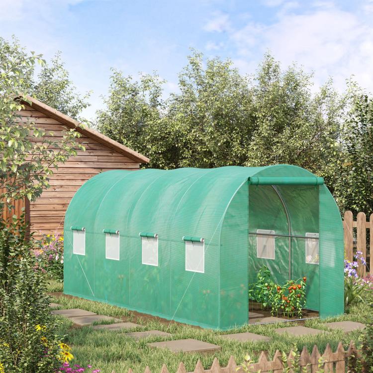 Green tunnel hoop greenhouse with zippered front door and side mesh panels
