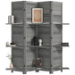 Gray folding room divider with shutter-style panels and three shelves holding decor