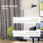 Black and gold floor lamp with round base, adjustable balance arm, and dome shade