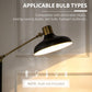 Black and gold floor lamp with arched arm and dome shade