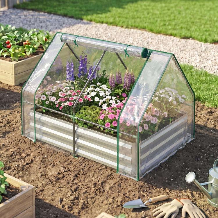 Raised garden bed planter with clear cover and green metal frame, protective greenhouse style
