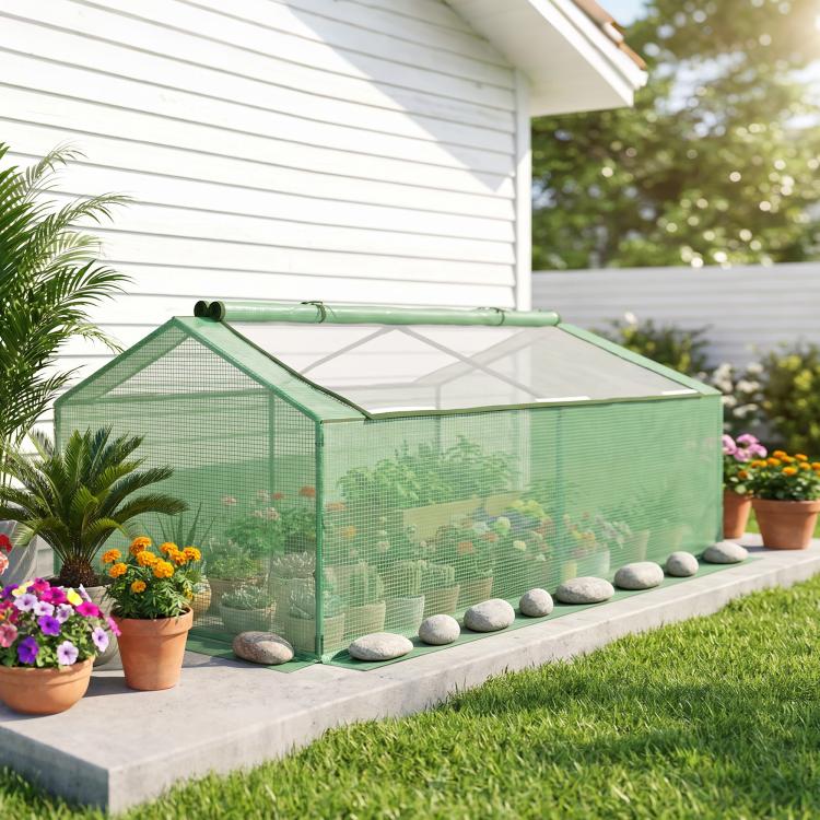 Green mini greenhouse on a patio with transparent mesh walls and roof