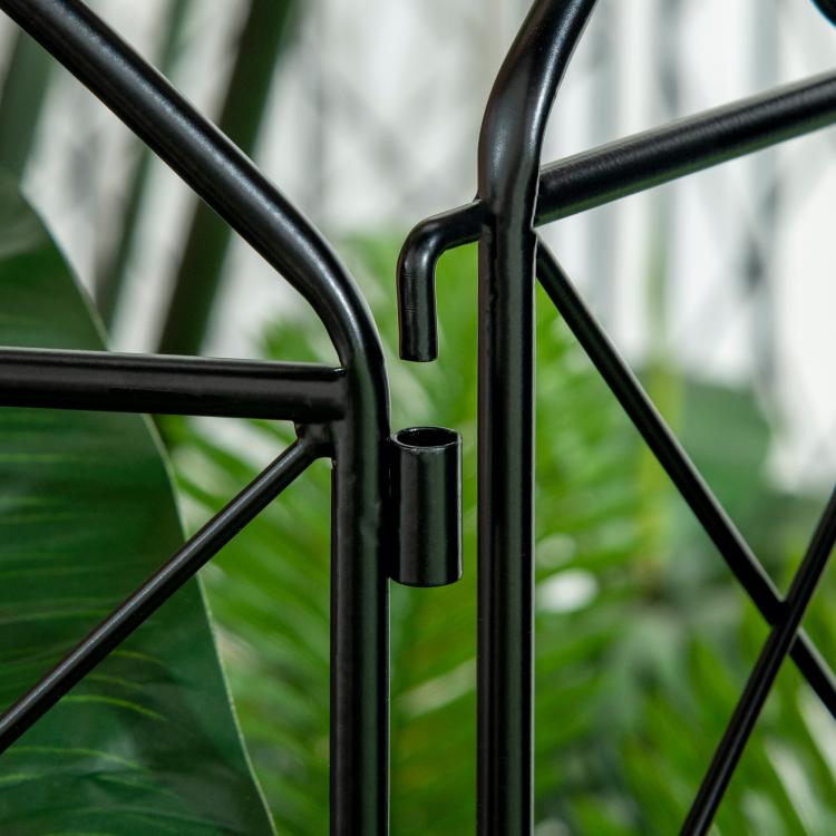Black steel fence frame joint with curved tubing and glossy finish