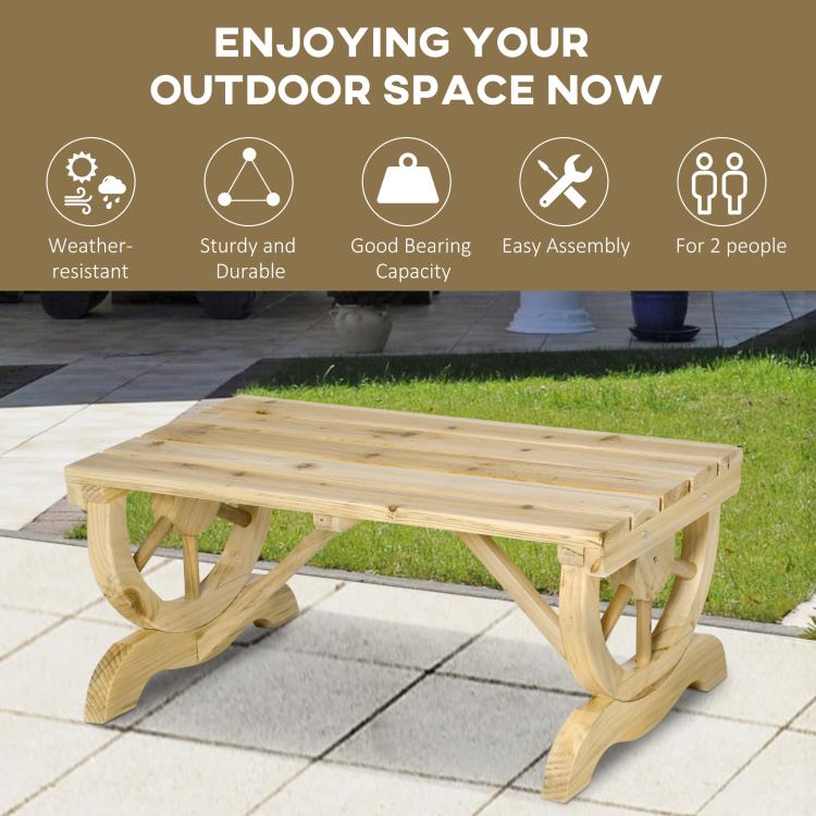 Natural wood outdoor bench on patio with wagon-wheel legs and slatted seat