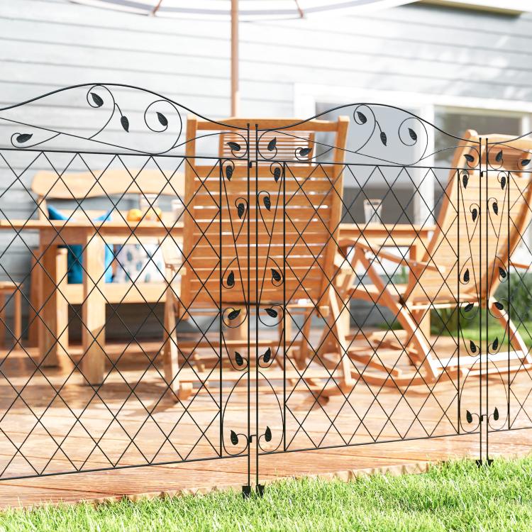 Black steel privacy-style fence panel with diamond lattice and ornate scroll detailing