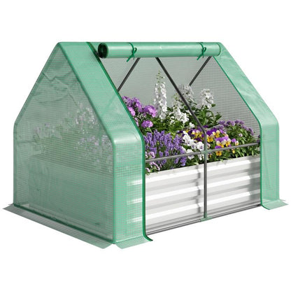 Galvanized raised garden bed with mini greenhouse cover and planted flowers inside