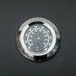 Black grill lid thermometer gauge with temperature markings close-up