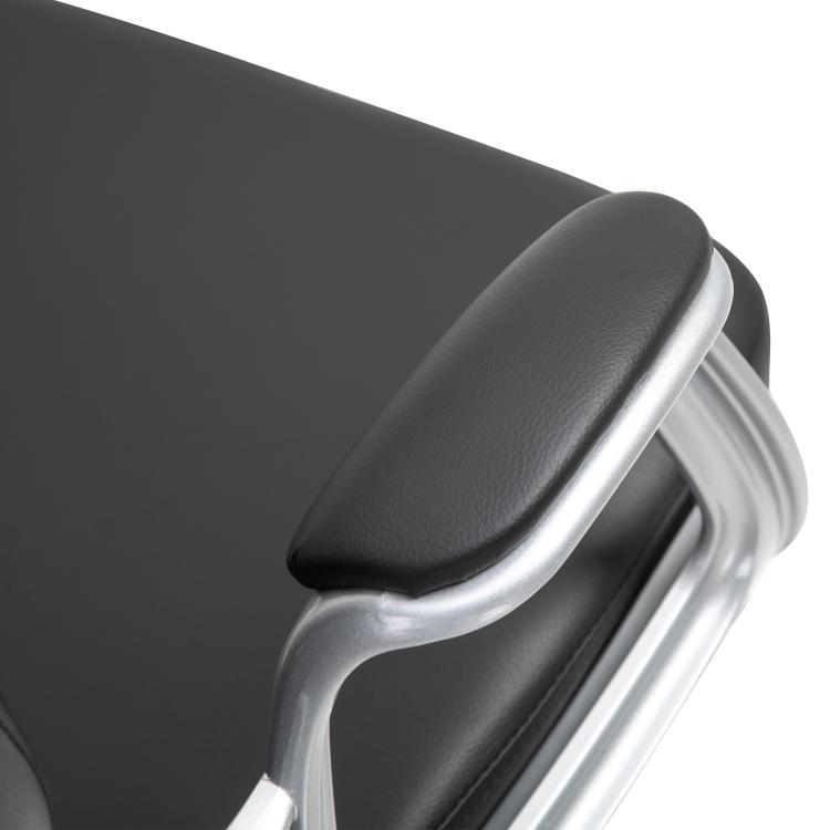 Padded desk chair armrest with curved black upholstery and chrome support.