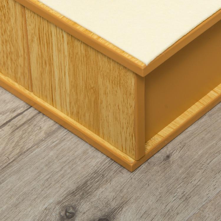 Natural wooden pet stairs with cushioned white step covers, close-up side view