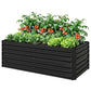 Black steel raised garden bed planted with green vegetables and tomatoes