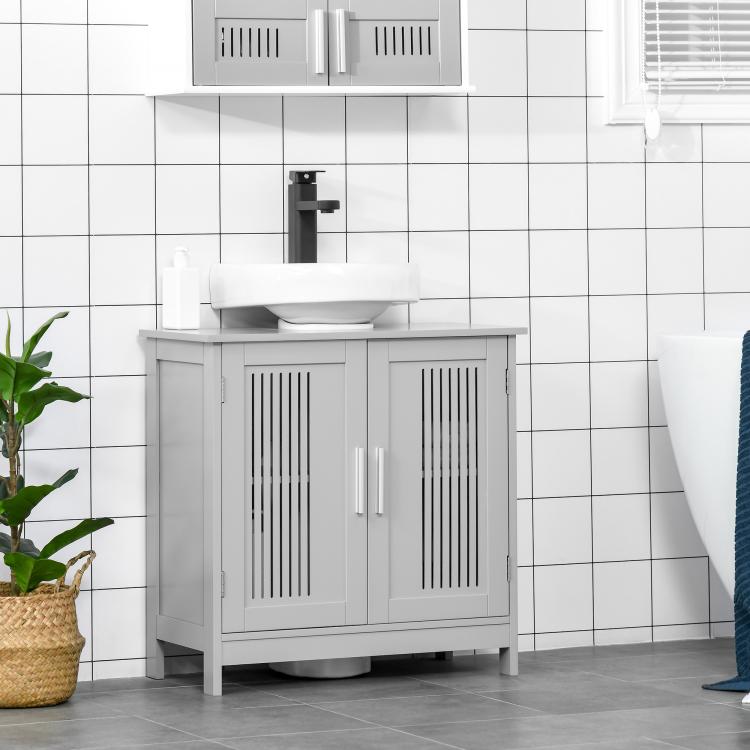 Grey under-sink bathroom storage cabinet with two doors and slatted ventilation panels.