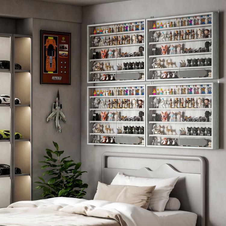 Gray wall display cabinet with glass doors mounted above a bed, showing figurines inside.