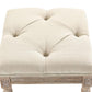Beige upholstered ottoman footrest with tufted seat and rounded top edges