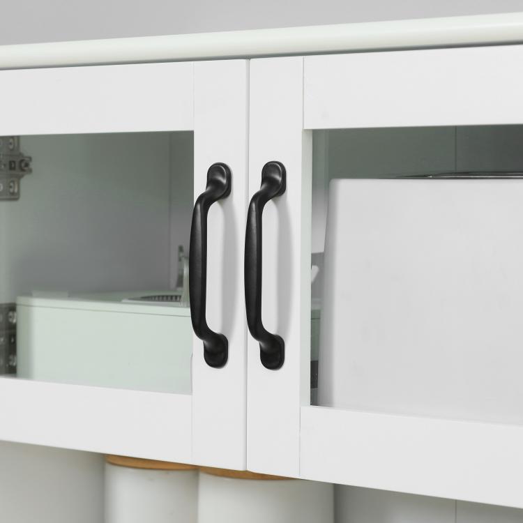 White cabinet doors with curved black handles, open shelf compartments above