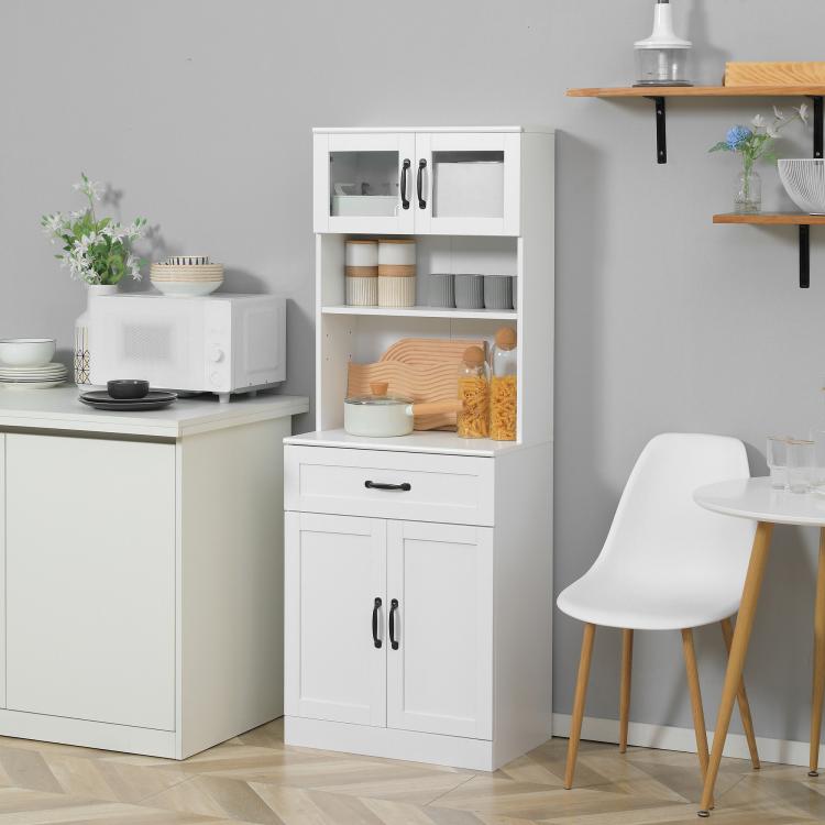 White pantry cabinet with open shelves, center drawer, and lower double cabinet doors.