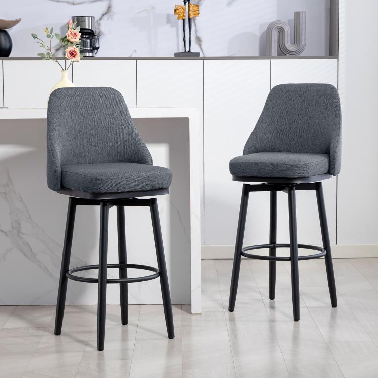 Dark gray upholstered swivel bar stool with curved back and round footrest