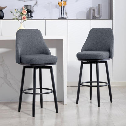 Dark gray upholstered swivel bar stool with curved back and round footrest