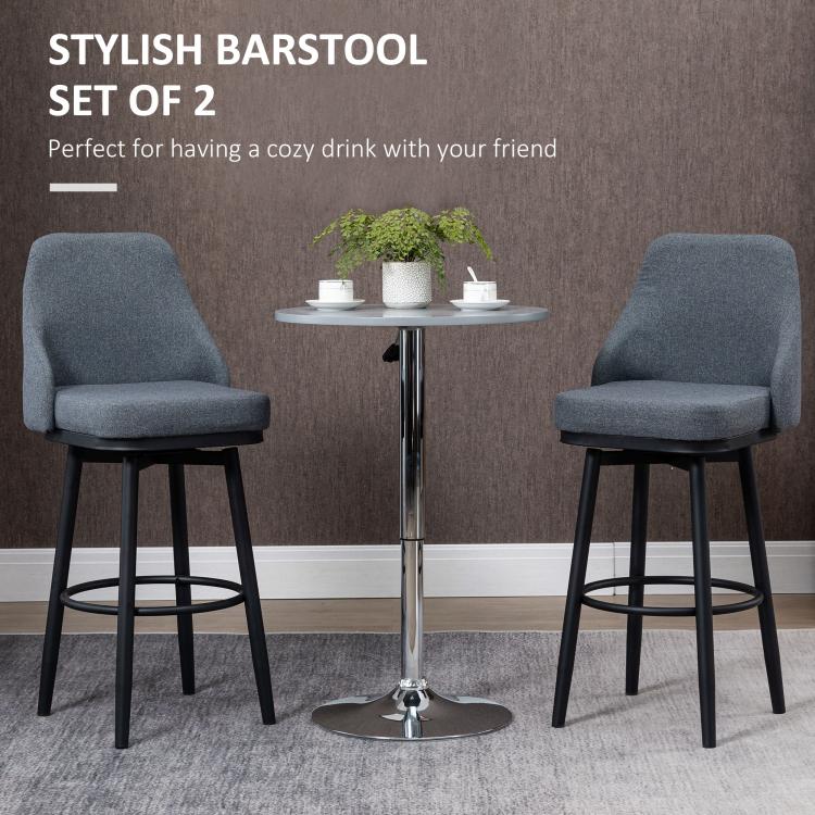 Set of 2 dark gray upholstered bar stools with swivel bases and round footrests