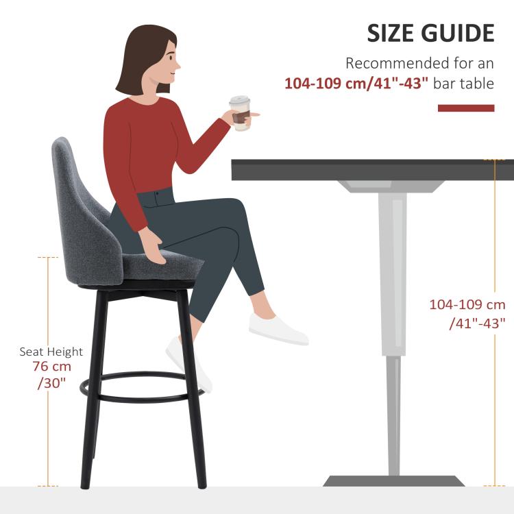 Dark gray upholstered bar stool with black legs and round footrest, size shown