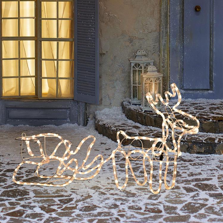 Warm white lit reindeer and sleigh LED yard decoration with wire outline