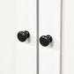 White cabinet doors with black round knob handles