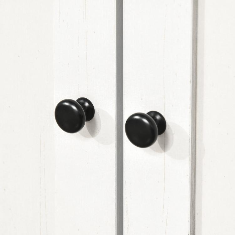 White cabinet doors with black round knob handles