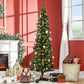 Pre-lit artificial Christmas tree with warm white lights and red baubles on green needles.