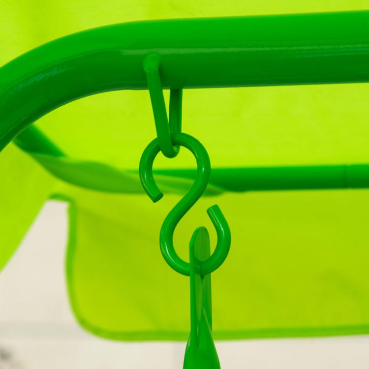 Close-up of green canopy hook and hanging loop on patio swing