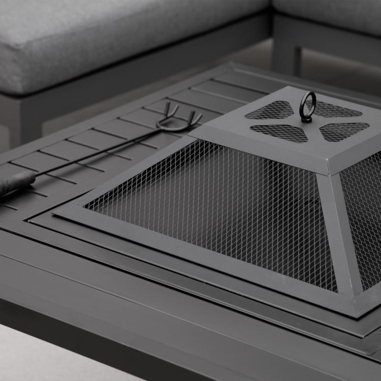 Black fire pit grill with spark screen and cooking grate over fire bowl