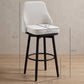 Cream upholstered bar stool with curved back, black legs, and circular footrest