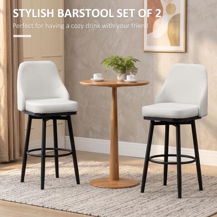 Cream bar stools set of 2 with padded seat, arched backs, and black circular footrests