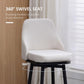Cream bar stool with padded seat and rounded back, black circular footrest frame