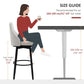 Cream bar stool with cushioned seat and curved back, shown beside a bar table