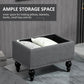 Gray storage ottoman with hinged lid open, interior storage space, studded trim