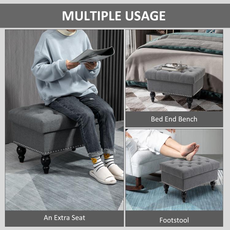 Gray storage ottoman used as extra seat, tufted lid, nailhead trim, turned legs