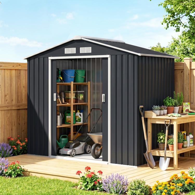Dark gray outdoor storage shed with open sliding doors and visible interior shelving