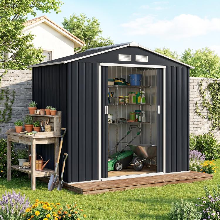 Dark gray outdoor storage shed with open front doors and stored garden tools inside