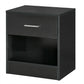 Black wood-grain end table with drawer front and open lower storage compartment.