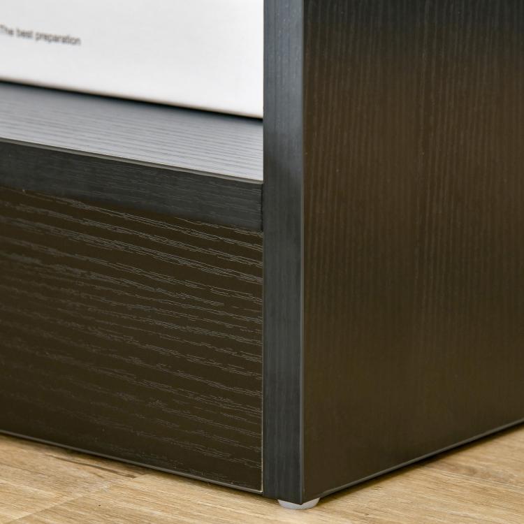 Black wood-grain side table corner with drawer and open shelf