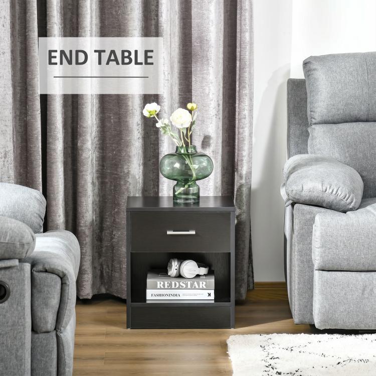 Black wood-grain end table with drawer and open lower shelf for items.
