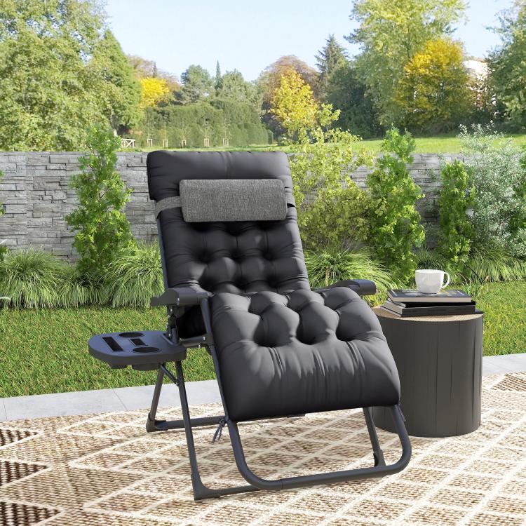 Black padded zero gravity recliner chair with cup holder tray and tufted cushions