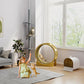 Gray cat climbing tower with stacked platforms next to a round viewing window accessory