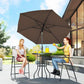 Outdoor patio bar set with brown umbrella and round table between two folding chairs