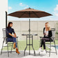Outdoor patio bar set with brown umbrella and round table between two folding chairs