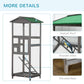 Grey wooden bird cage aviary with green roof, elevated base, and interior wooden stairs