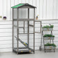 Grey wooden outdoor bird aviary house with green roof and perch, bird inside wire panels
