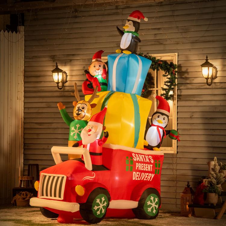 Inflatable Santa gift car with penguin top figure, lit for outdoor Christmas decor